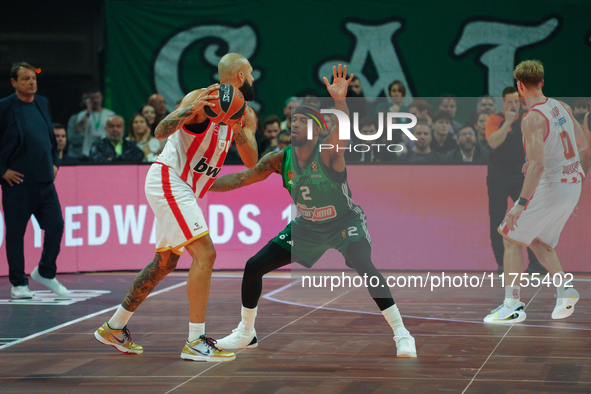 Evan Fournier and Lorenzo Brown are in an action moment during the Euroleague game between Panathinaikos and Olympiacos, with a final score...