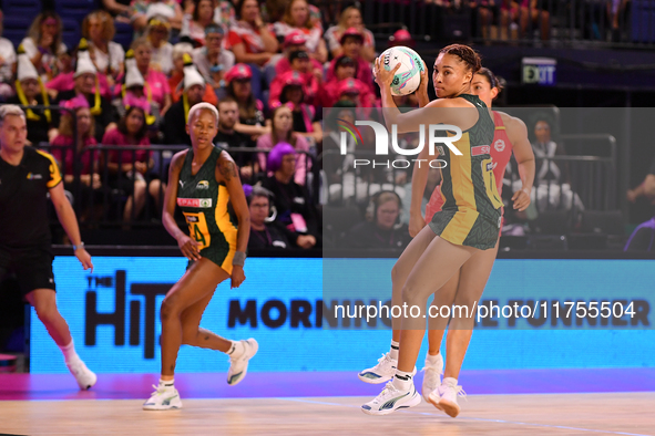 Amber Coraizin of South Africa (R) runs with the ball during the Fast5 Netball World Series match between England and South Africa at the Wo...