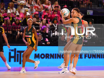 Amber Coraizin of South Africa (R) runs with the ball during the Fast5 Netball World Series match between England and South Africa at the Wo...