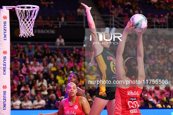 Sanmarie Visser of South Africa attempts to catch the ball as Harriet Jones of England shoots during the Fast5 Netball World Series match be...