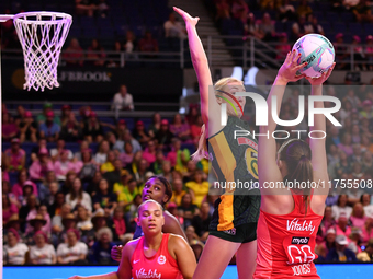 Sanmarie Visser of South Africa attempts to catch the ball as Harriet Jones of England shoots during the Fast5 Netball World Series match be...