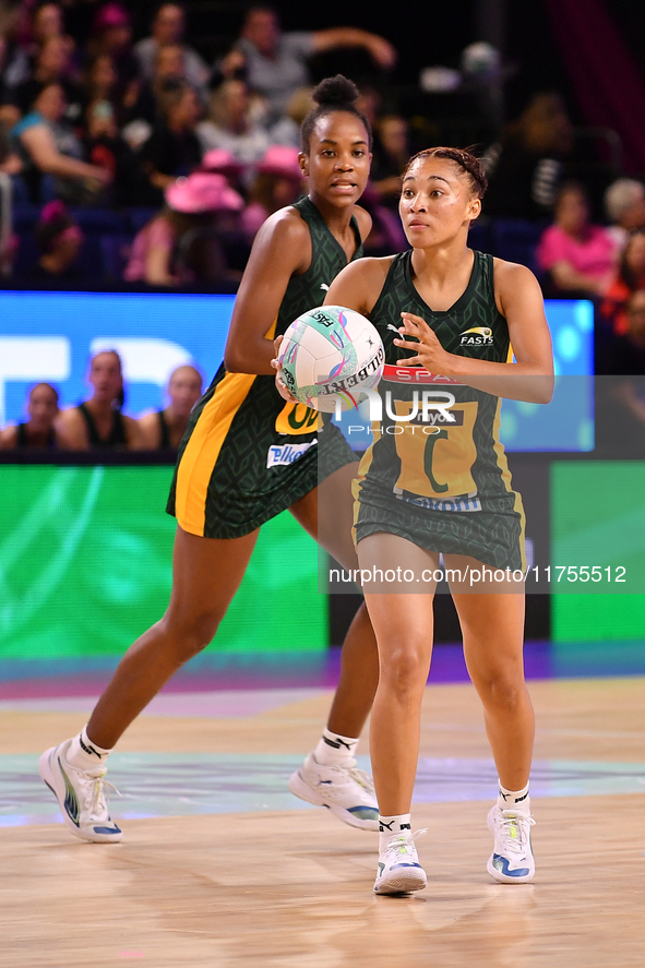 Amber Coraizin of South Africa (R) runs with the ball during the Fast5 Netball World Series match between England and South Africa at the Wo...