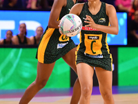 Amber Coraizin of South Africa (R) runs with the ball during the Fast5 Netball World Series match between England and South Africa at the Wo...