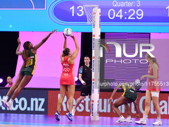 Paige Reed of England (C) shoots during the Fast5 Netball World Series match between England and South Africa at the Wolfbrook Arena in Chri...