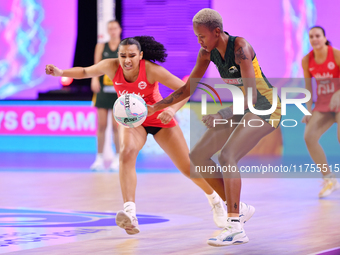 Kamogelo Maseko of South Africa and Isabella Philips of England compete for the ball during the Fast5 Netball World Series match between Eng...