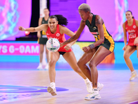 Kamogelo Maseko of South Africa and Isabella Philips of England compete for the ball during the Fast5 Netball World Series match between Eng...