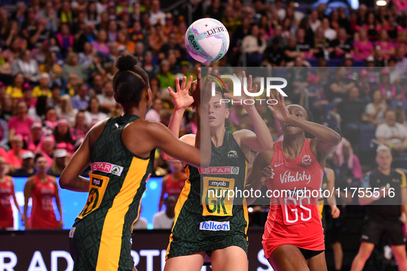 Boitumelo Mahloko (L) and Ane Retief (C) of South Africa compete with Sophie Egbaran of England for the ball during the Fast5 Netball World...