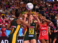 Boitumelo Mahloko (L) and Ane Retief (C) of South Africa compete with Sophie Egbaran of England for the ball during the Fast5 Netball World...