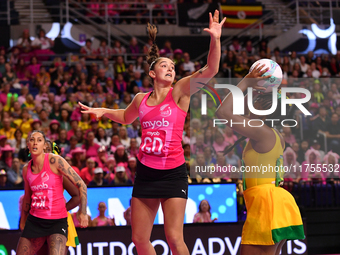 Amanda Pinkney of Jamaica shoots as Kate Burley of New Zealand attempts to catch the ball during the Fast5 Netball World Series match betwee...