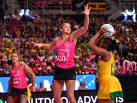 Amanda Pinkney of Jamaica shoots as Kate Burley of New Zealand attempts to catch the ball during the Fast5 Netball World Series match betwee...