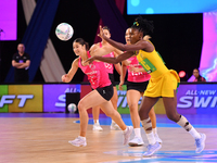 Zaudi Green of Jamaica (R) passes the ball during the Fast5 Netball World Series match between New Zealand and Jamaica in Christchurch, New...