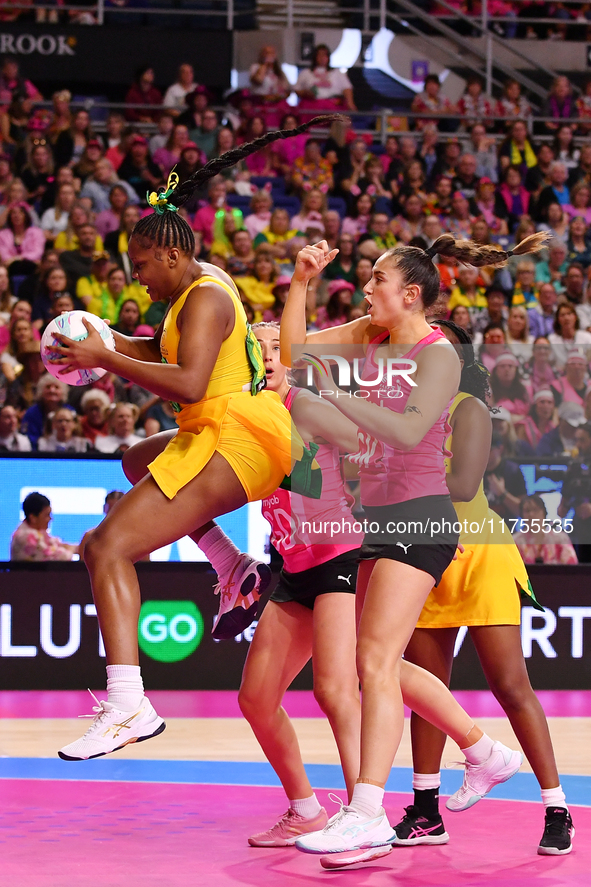 Amanda Pinkney of Jamaica (L) and Kate Burley of New Zealand (R) compete for the ball during the Fast5 Netball World Series match between Ne...