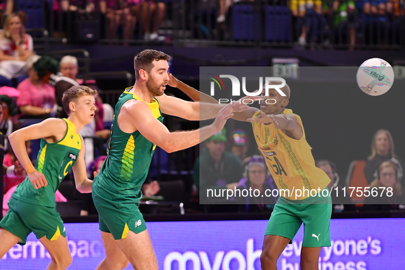 Alastair Punshon of Australia (C) passes the ball during the Fast5 Netball World Series match between Australia and South Africa at the Wolf...