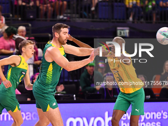 Alastair Punshon of Australia (C) passes the ball during the Fast5 Netball World Series match between Australia and South Africa at the Wolf...