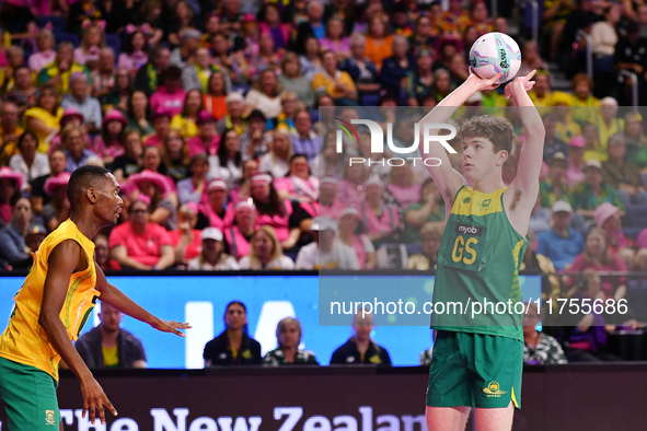 William Whiteacre of Australia (R) shoots during the Fast5 Netball World Series match between Australia and South Africa in Christchurch, Ne...