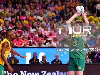 William Whiteacre of Australia (R) shoots during the Fast5 Netball World Series match between Australia and South Africa in Christchurch, Ne...