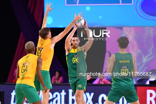 Alastair Punshon of Australia (C) passes the ball during the Fast5 Netball World Series match between Australia and South Africa at the Wolf...