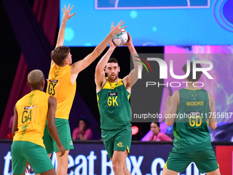 Alastair Punshon of Australia (C) passes the ball during the Fast5 Netball World Series match between Australia and South Africa at the Wolf...