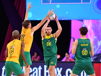 Alastair Punshon of Australia (C) passes the ball during the Fast5 Netball World Series match between Australia and South Africa at the Wolf...