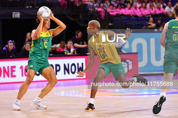 Eugene Sinxesi of South Africa and Liam Forcadilla of Australia compete for the ball during the Fast5 Netball World Series match between Aus...