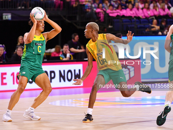 Eugene Sinxesi of South Africa and Liam Forcadilla of Australia compete for the ball during the Fast5 Netball World Series match between Aus...