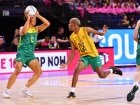 Eugene Sinxesi of South Africa and Liam Forcadilla of Australia compete for the ball during the Fast5 Netball World Series match between Aus...