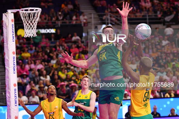 Alastair Punshon of Australia (C) and Eugene Sinxezi of South Africa (R) compete in the Fast5 Netball World Series match between Australia a...