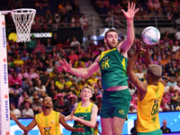 Alastair Punshon of Australia (C) and Eugene Sinxezi of South Africa (R) compete in the Fast5 Netball World Series match between Australia a...