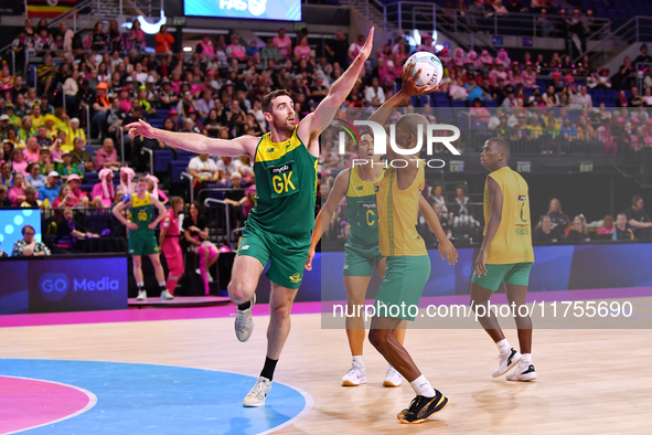 Alastair Punshon of Australia and Eugene Sinxezi of South Africa compete in the Fast5 Netball World Series match between Australia and South...