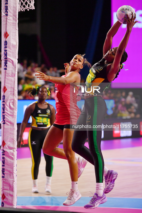 Jayda Pechova of England and Simone Gordon of Jamaica compete for the ball during the Fast5 Netball World Series match between England and J...