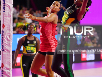 Jayda Pechova of England and Simone Gordon of Jamaica compete for the ball during the Fast5 Netball World Series match between England and J...