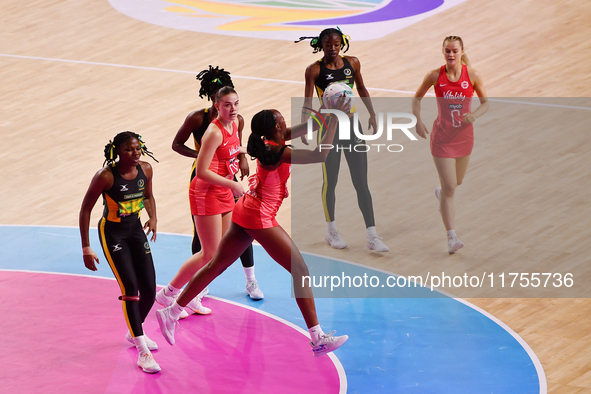 Sophie Egbaran of England controls the ball during the Fast5 Netball World Series match between England and Jamaica at the Wolfbrook Arena i...