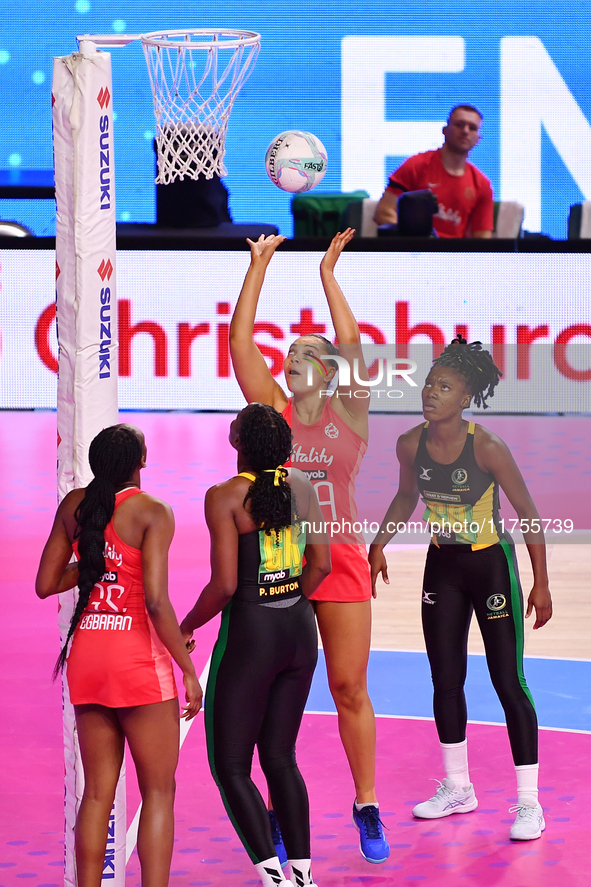 Paige Reed of England (second from right) shoots during the Fast5 Netball World Series match between England and Jamaica at the Wolfbrook Ar...