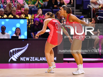 Tash Pavelin (L) and Jayda Pechova of England react during the Fast5 Netball World Series match between England and Jamaica at the Wolfbrook...