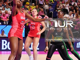 Sophie Egbaran of England (L) catches the ball during the Fast5 Netball World Series match between England and Jamaica at the Wolfbrook Aren...