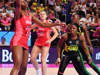 Sophie Egbaran of England (L) catches the ball during the Fast5 Netball World Series match between England and Jamaica at the Wolfbrook Aren...