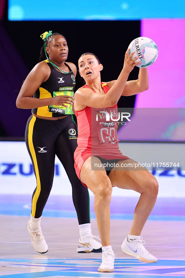 Zara Everitt of England (R) and Amanda Pinkney compete in the Fast5 Netball World Series match between England and Jamaica at the Wolfbrook...