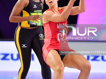 Zara Everitt of England (R) and Amanda Pinkney compete in the Fast5 Netball World Series match between England and Jamaica at the Wolfbrook...