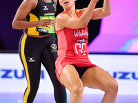 Zara Everitt of England (R) and Amanda Pinkney compete in the Fast5 Netball World Series match between England and Jamaica at the Wolfbrook...