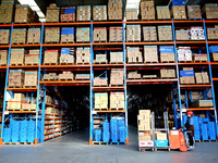 A staff member transfers goods at an e-commerce logistics warehouse in Lianyun district, Lianyungang, China, on November 9, 2024. (