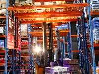 A staff member transfers goods at an e-commerce logistics warehouse in Lianyun district, Lianyungang, China, on November 9, 2024. (