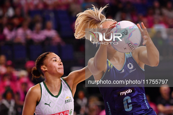 Leesa Mi Mi of Australia and Amber Coraizin of South Africa compete for the ball during the Fast5 Netball World Series match between Austral...