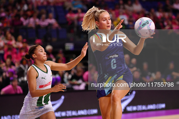 Leesa Mi Mi of Australia and Amber Coraizin of South Africa compete for the ball during the Fast5 Netball World Series match between Austral...