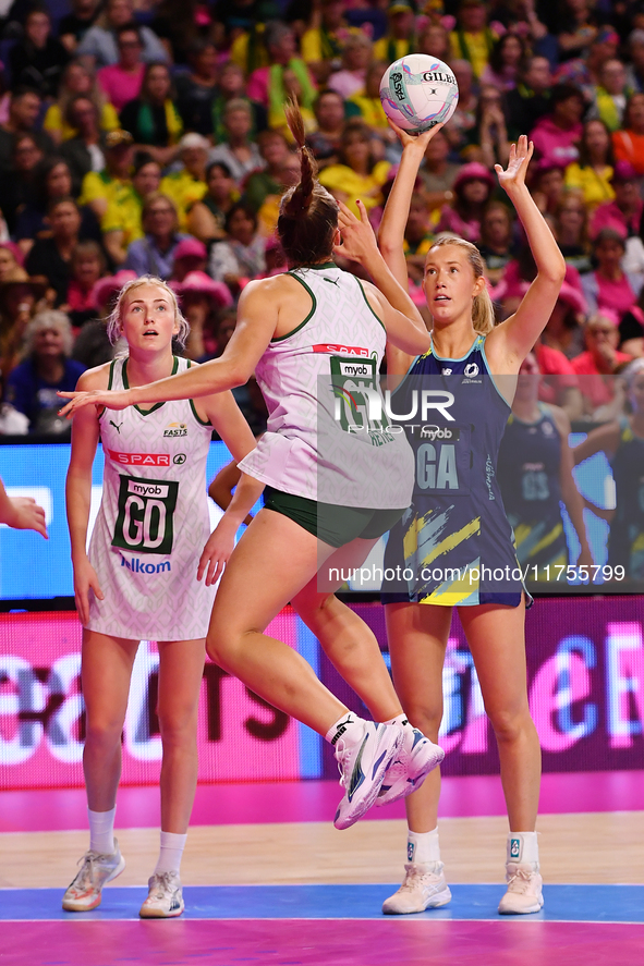 Lauren Frew of Australia (R) shoots during the Fast5 Netball World Series match between Australia and South Africa at the Wolfbrook Arena in...