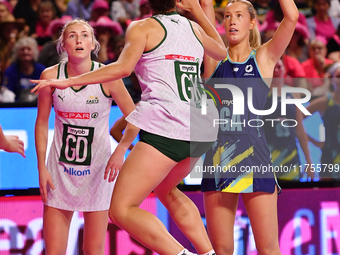 Lauren Frew of Australia (R) shoots during the Fast5 Netball World Series match between Australia and South Africa at the Wolfbrook Arena in...