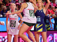 Lauren Frew of Australia (R) shoots during the Fast5 Netball World Series match between Australia and South Africa at the Wolfbrook Arena in...