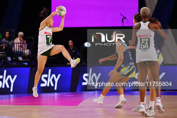 Shannen Bartlett of South Africa (L) catches the ball during the Fast5 Netball World Series match between Australia and South Africa at the...