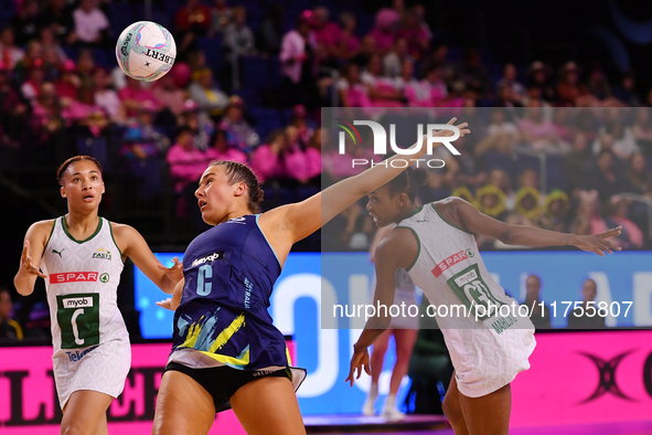 Amy Sligar of Australia, South Africa's Boitumelo Mahloko, and Amber Coraizin compete in the Fast5 Netball World Series match between Austra...