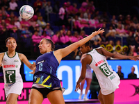 Amy Sligar of Australia, South Africa's Boitumelo Mahloko, and Amber Coraizin compete in the Fast5 Netball World Series match between Austra...