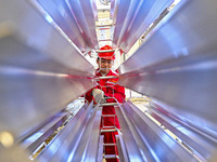 A worker works at a gas purification equipment manufacturing company in Qingzhou Economic Development Zone in Qingzhou, China, on November 9...